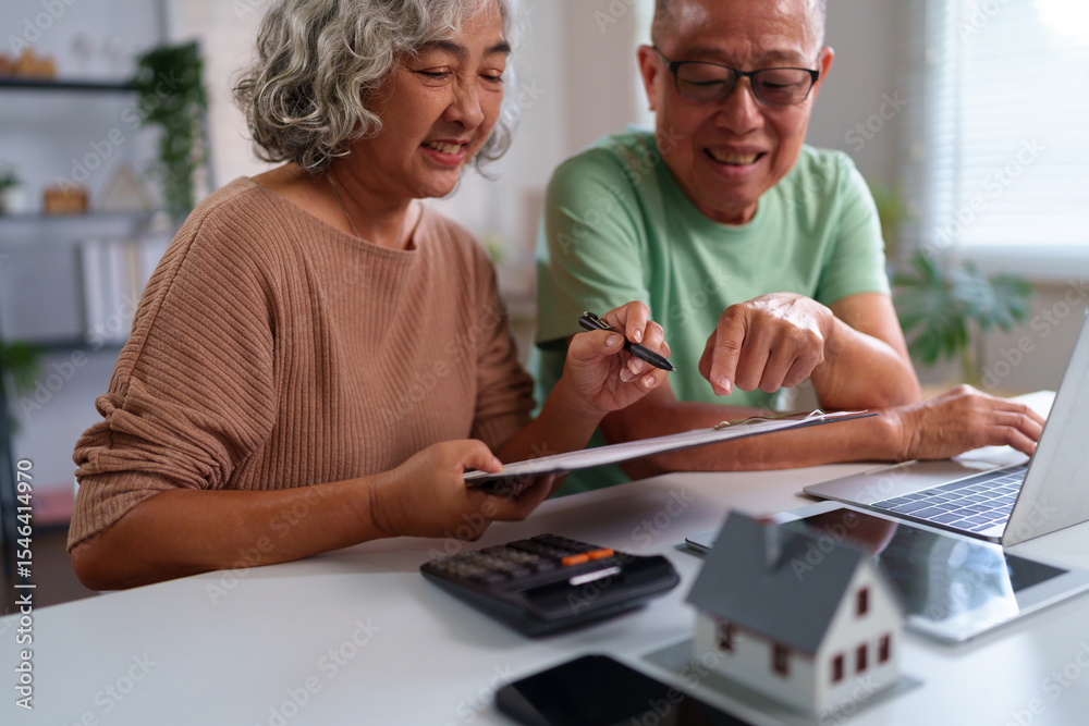 Obraz premium Asian Older Couple Planning Home Finances Together Retirement Savings Investment with Laptop Calculator and House Model Dream Life