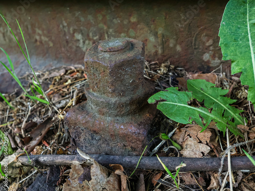 Railway track fastening, slightly rusty, close-up