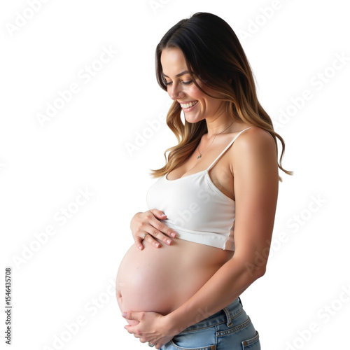 A radiant woman stands gracefully, gently cradling her round baby bump with a warm smile. She embodies the beauty of expectancy and joy, dressed casually and comfortably.
