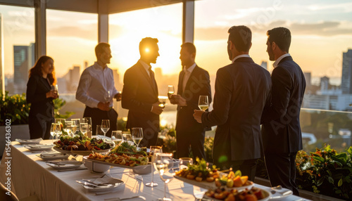 Elegant business event with appetizers and sunset view, creating warm atmosphere