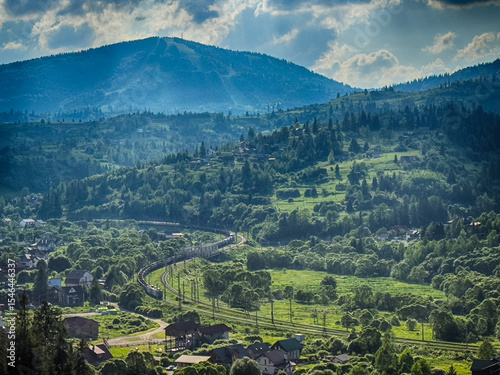 Scenic View of the Carpathian Mountains Covered by Clouds on a Sunny Day