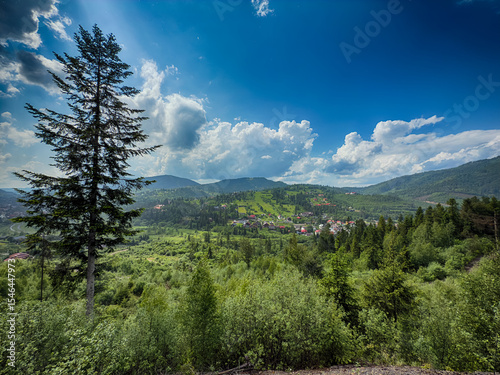 Scenic View of the Carpathian Mountains Covered by Clouds on a Sunny Day