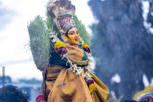 Kulasai, Idol of hindu god sri mutharamman carrying by devotees during the celebration of kulasai dasara festival.