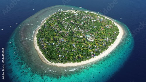 Aerial around view of tropical island Balicasag surrounded by turquoise waters and coral reefs, Philippines, 4k