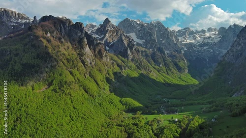 Aerial view of amazing rocky mountains in snow before sunset, Prokletie, Montenegro, 4k