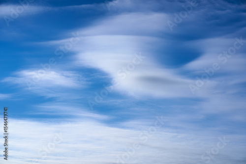 Blue sky with flow cloud like a wing of bird for background.