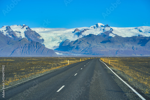 View of giant glacia mountain snow and road in Iceland for road trip travel.