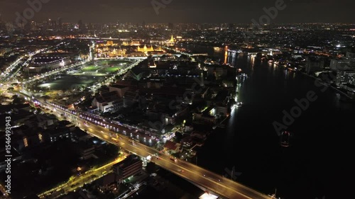Aerial view of royal Grand palace and Wat Arun at night in Bangkok, Thailand, 4k