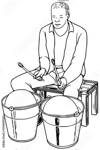 Man playing drums made from buckets