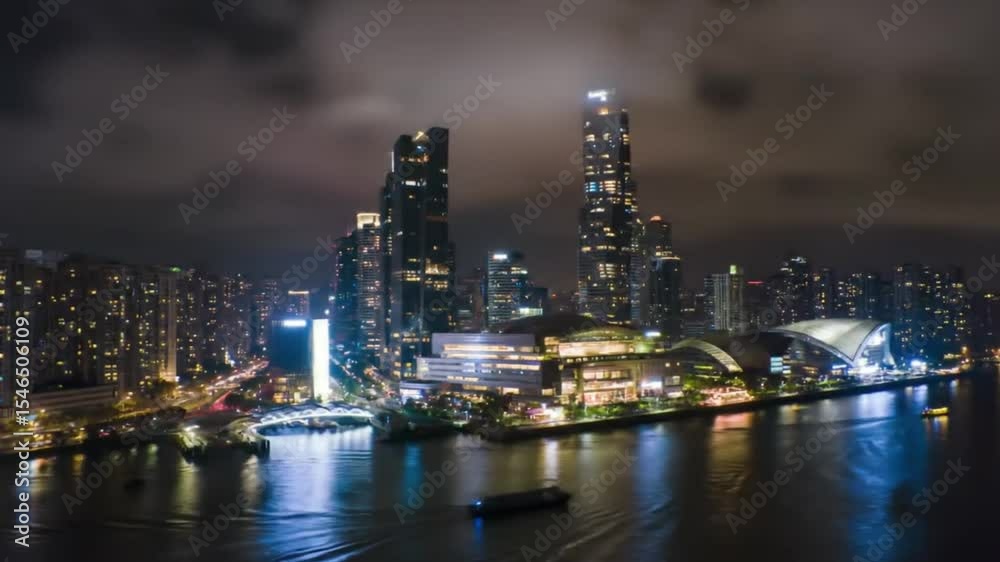 Prom night skyline of west Kowloon, glowing with skyscrapers and vibrant waterfront buildings, perfect for cityscape backgrounds and travel publications. Prom night skyline of west Kowloon, glowing with skyscrapers and vibrant waterfront buildings, perfect for cityscape backgrounds and travel publications.