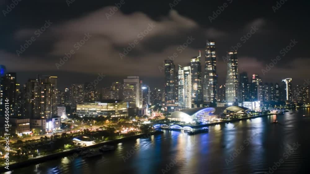 Prom night skyline of west Kowloon, glowing with skyscrapers and vibrant waterfront buildings, perfect for cityscape backgrounds and travel publications. Prom night skyline of west Kowloon, glowing with skyscrapers and vibrant waterfront buildings, perfect for cityscape backgrounds and travel publications.