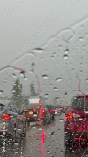 Heavy rainy traffic. View from inside a car.car driving in the rain in a traffic jam.