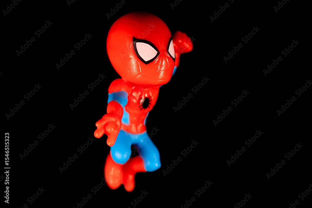 Obraz premium Kinder Surprise Marvel Spider-Man in a fighting position releases a web and strikes in a jump