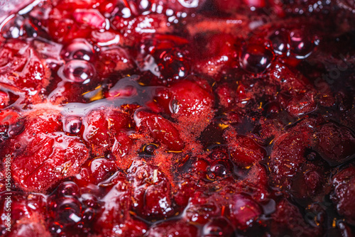 Background with the texture of jam or jam made of cherries and strawberries.