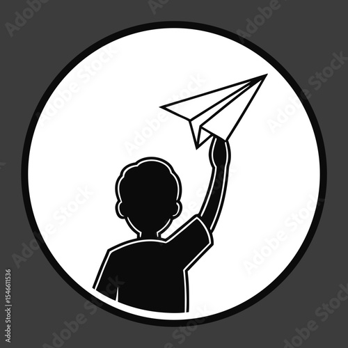 A child plays with a paper airplane
