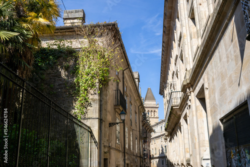 Historic Rua de Xelmírez street leading to Santiago de Compostela Cathedral in Galicia, Spain. A charming European old town view with cobbled paths and medieval architecture.