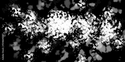 Snowflakes on dark background. white icy snowflakes isolated on black background, natural background. white crystalline powder on a black background. sugar dust. texture, pattern and clipping.