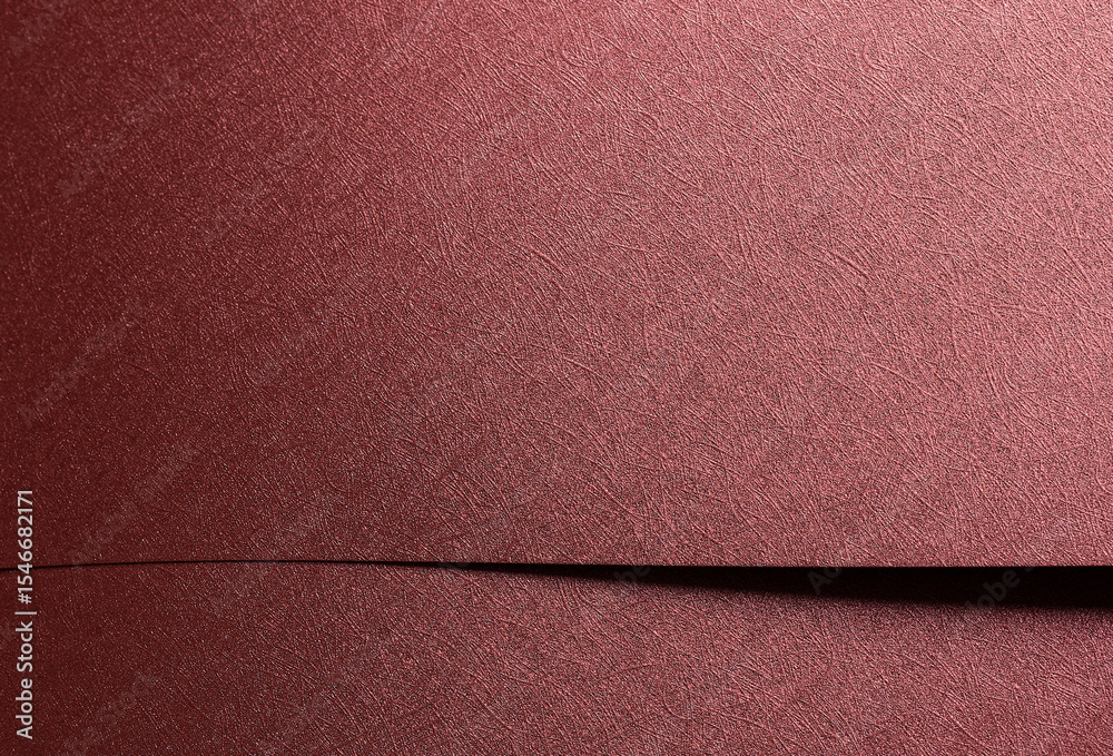 Fototapeta premium Chic paper closeup. Monochrome red and marsala surface with metallic gloss, geometric overlap,