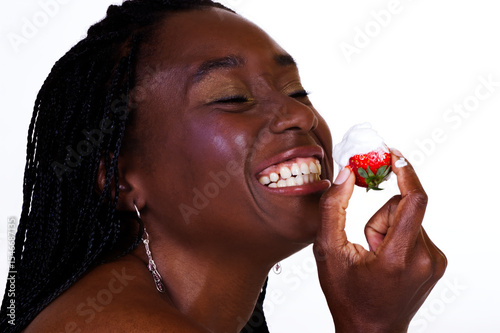 African American Woman With Big Smiling Holding Up Strawberry