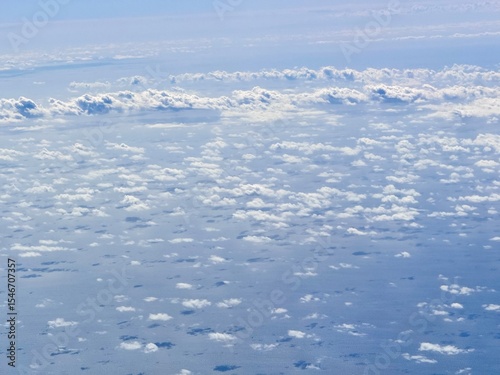 white clouds seen from an airplane above the sea and the Bahamas
