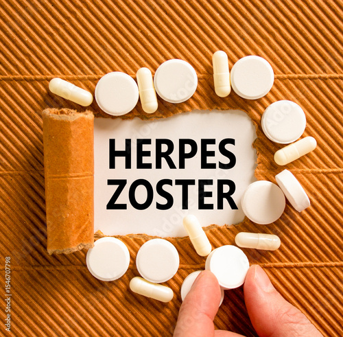 Herpes zoster symbol. Concept words Herpes zoster on beautiful white paper. White pills tablets. Doctor's hand. Beautiful brown background. Medical healthy lifestyle herpes zoster concept.