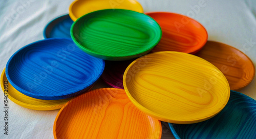 Colorful stack of wooden plates