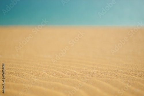Golden sand dunes meet turquoise sea free beach background Beach Ocean