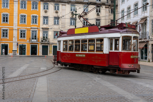 Vintage Red Tram in Lisbon Square Description