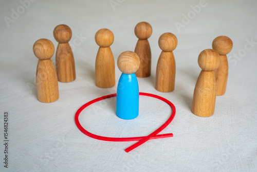 Photos The blue human figure is separated from the rest of the people by a red circle