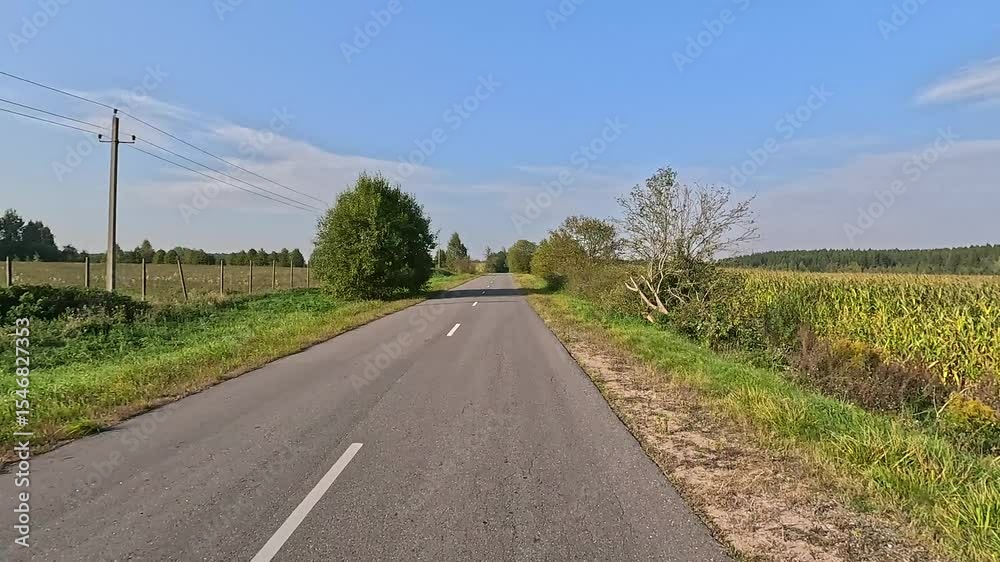 road in the countryside, roadside and asphalt, green forest and fields, blue sky and clouds road in the countryside, roadside and asphalt, green forest and fields, blue sky and clouds