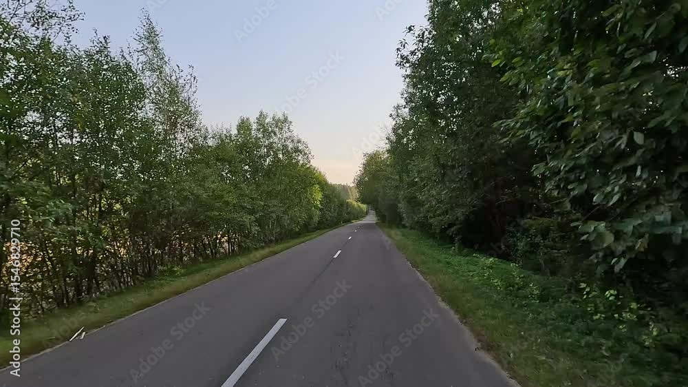 road in the countryside, roadside and asphalt, green forest and fields, blue sky and clouds road in the countryside, roadside and asphalt, green forest and fields, blue sky and clouds