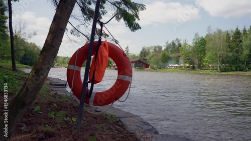 Bright Lifebuoy on Lakeside Path