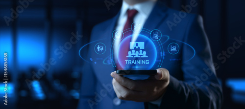 Businessman Holding smartphone with Training Icons on Screen. E-Learning and online Education concept