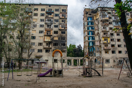 Children's playground standing in the courtyard amidst destroyed residential buildings in Kyiv, Ukraine, after a russian missile attack on June 17, 2025