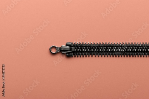 black zipper on terracotta background in product-style layout