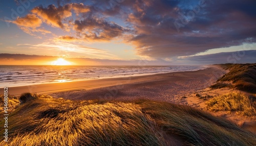 golden clouds above quidnet beach at sunrise