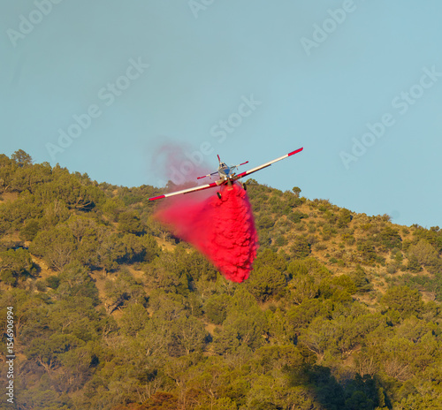 Single Engine Air Tankers Drop Fire Retardant at a Wildfire