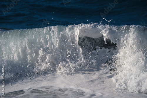 Fototapeta Naklejka Na Ścianę i Meble -  Breaking ocean wave with white sea foam on the coast