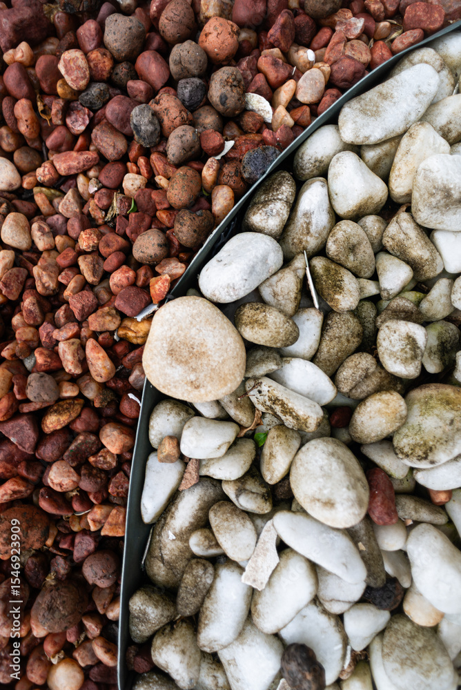 Obraz premium Frame full of decorative brown and white stones. Texture. Background.