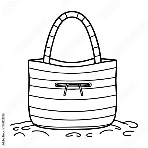 A striped tote bag sits on what appears to be ground or sand