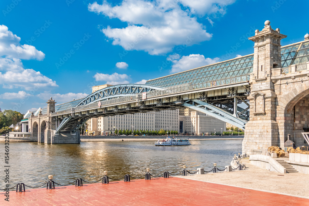 Fototapeta premium View of the Moscow river embankment, Pushkinsky bridge and cruise ships at sunset.
