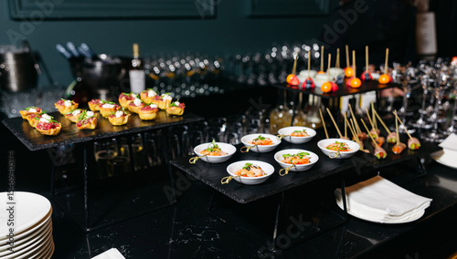 Elegant gourmet buffet table with appetizers.