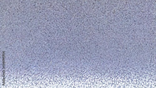 Silver glitter texture background for festive decoration projects, shimmering sparkles create elegant abstract surface for design work