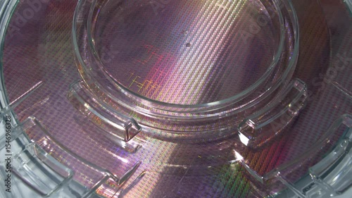 patterned silicon wafers in a universal pod. Electronic circuit designs have been built onto the wafers using micromaching including photolithography