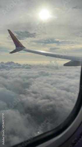 Experience the serene beauty of flight as airplanes glide through clouds