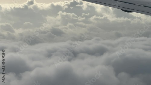 Enjoy serene aerial views of clouds from an airplane window