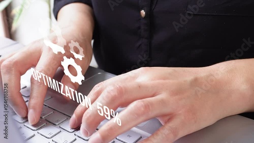 A woman working on a computer with an animated icon of three gears and a load: progress from 0 to 100%. Efficiency concept.