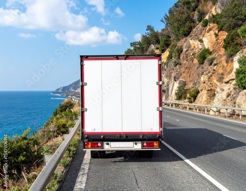 Truck on a coastal road with a view of the sea