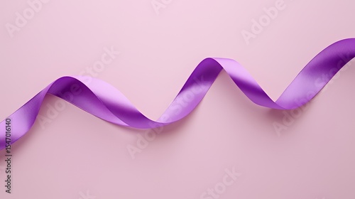 Elegant purple ribbon flowing gracefully against a soft pink background.