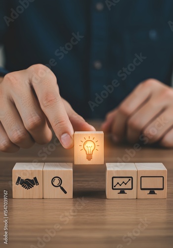 a solution-focused, problem-solving methodology used for innovation and strategic development. Design Thinking Process concept. Wooden blocks with icons; the key stages of the design thinking process